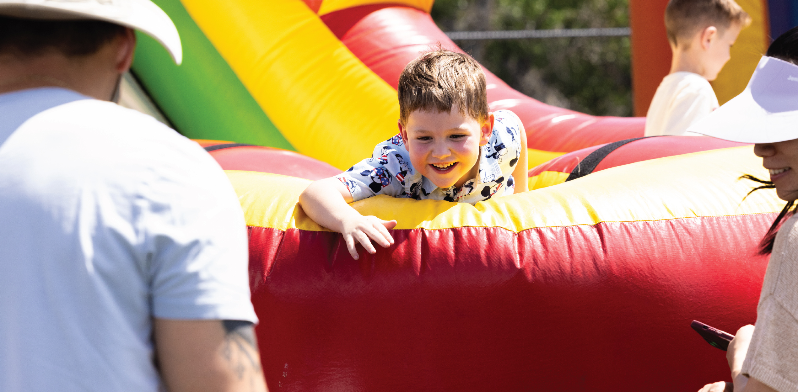 Child sliding down an inflatable slide.