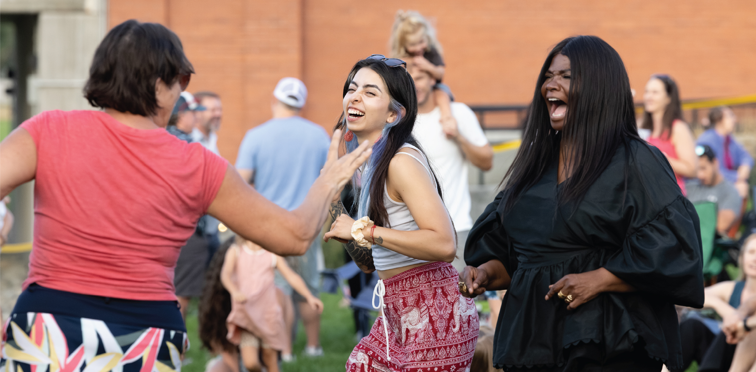 Group of friends laughing and grooving to the music.