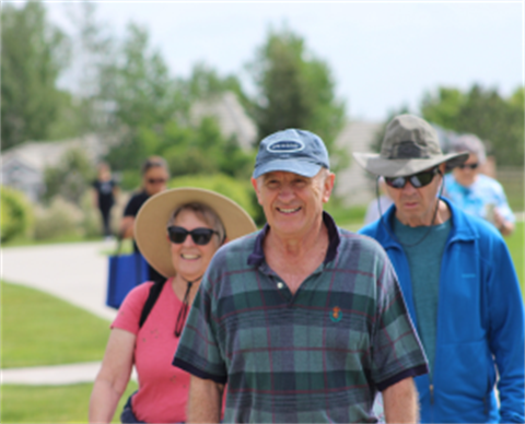 People walk during Walk with a Doc at Wildflower Park