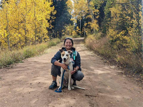 Phary Om and dog Summit on a trail