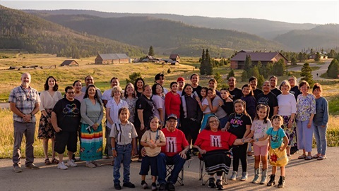 group photo of the right relationship group against a mountain backdrop